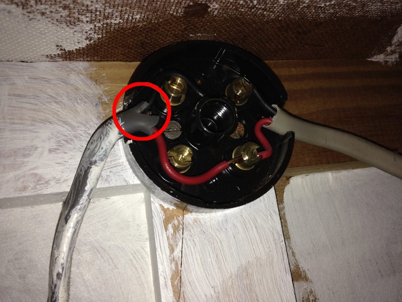 A scorched ceiling rose — a typical fault-finding callout