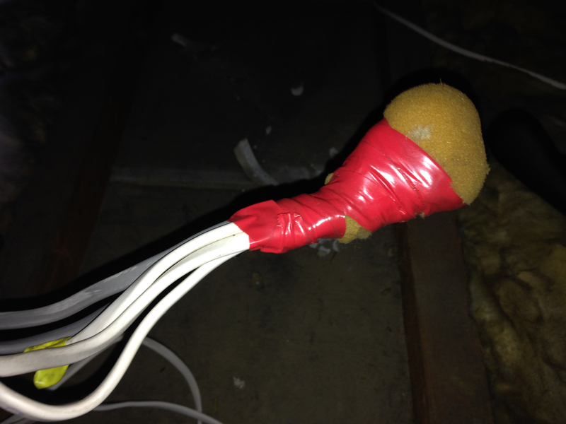 Lighting circuit cables insulated with sponge foam and tape in a loft