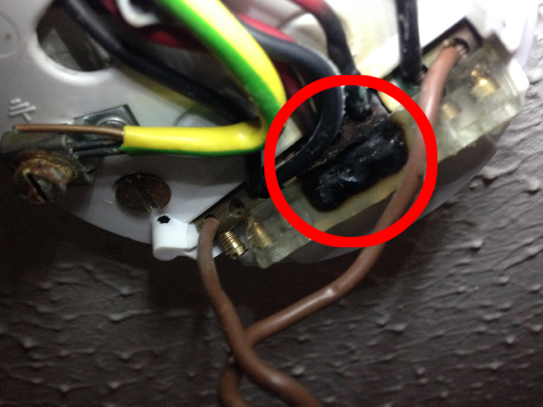 A poor connection overheating, burning and melting the insulation
