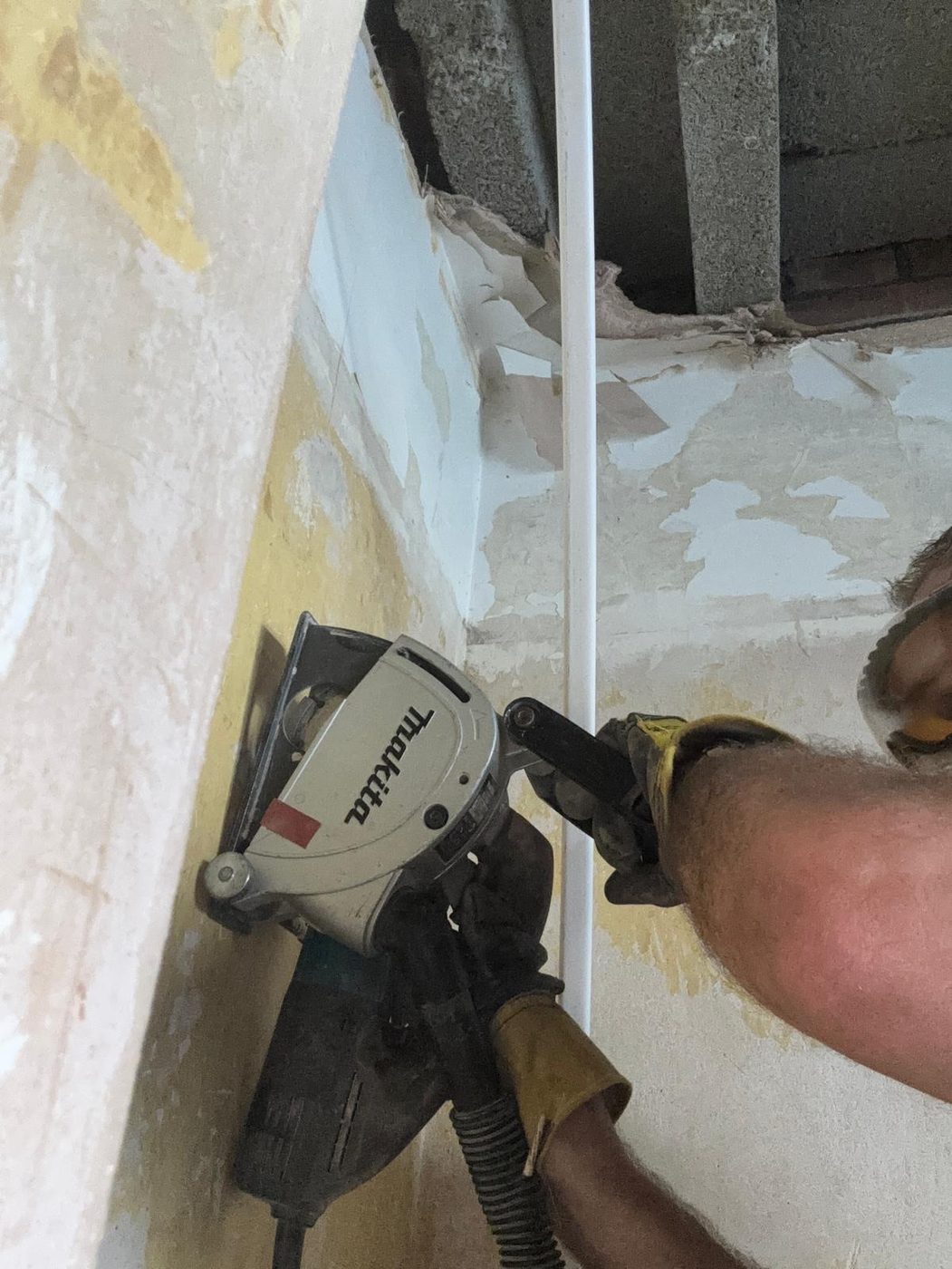 A wall chaser cutting a neat cable chase